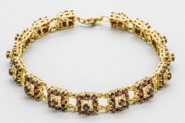 Pulsera en Oro de 18 Quilates con Granate